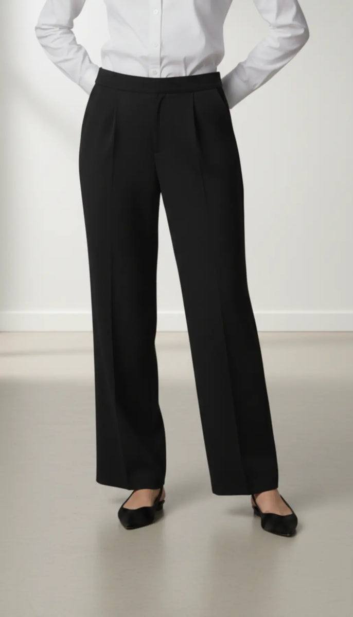 Person wearing a white shirt and black trouser on a plain background