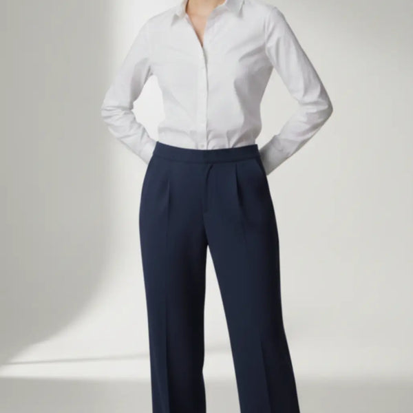 Person wearing a white shirt and navy pants on a white background