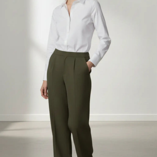 Person wearing a white shirt and olive pants against a white background