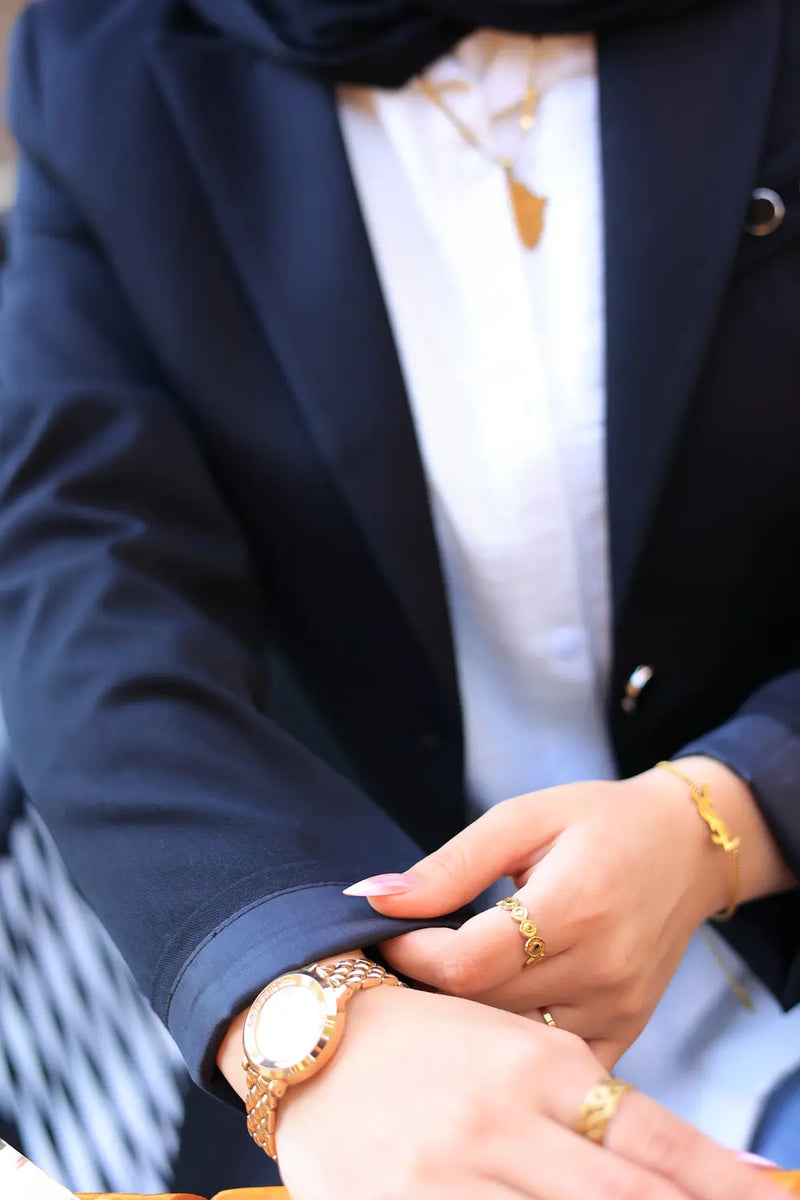 “ZAYTA black women’s blazer on model with white shirt and gold jewelry”
