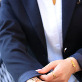 “ZAYTA black women’s blazer on model with white shirt and gold jewelry”
