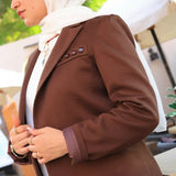 ZAYTA brown tailored blazer on model wearing white hijab, showing fabric and inner lining, outdoor setting
