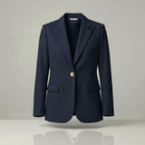 Navy blazer with a gold button on a light gray background