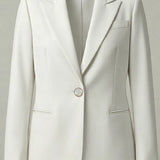White blazer on a light gray background