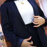 “ZAYTA navy women’s blazer on model over white top, blurred background”
